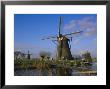 Canal And Windmills, Kinderdijk, Unesco World Heritage Site, Holland (The Netherlands), Europe by Gavin Hellier Limited Edition Print