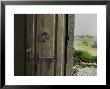Close View Of A Wooden Door On A Villa Opening To Hills Of Tuscany, Italy by Todd Gipstein Limited Edition Print