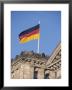 The German Flag Flies High Above The New Reichstag In Berlin, Germany by Jason Edwards Limited Edition Print