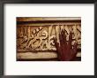A Man Runs His Hand Over Arabic Script At The Famous Jama Masjid by Eightfish Limited Edition Print