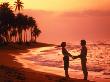 Silhouetted Couple Standing On A Tropical Beach by Wallace Garrison Limited Edition Print