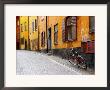 Street Scene In Gamla Stan Section With Bicycle And Mailbox, Stockholm, Sweden by Nancy & Steve Ross Limited Edition Print