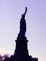 Statue Of Liberty Silhouetted by Fogstock Llc Limited Edition Print