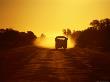 Truck On Dirt Road At Sunset, Australia by Chris Mellor Limited Edition Print