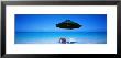 Chairs Under An Umbrella On The Beach, Turks And Caicos Islands, North Atlantic Ocean by Panoramic Images Limited Edition Print