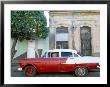 Old American Car Parked Beneath Fruit Tree, Cienfuegos, Cuba, West Indies, Central America by Lee Frost Limited Edition Print