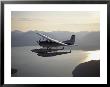 A Seaplane Takes A Sightseeing Tour Over Misty Fjord by Bill Curtsinger Limited Edition Print