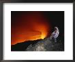 Scientist In Full Helmet And Thermal Suit Collects Lava Samples by Peter Carsten Limited Edition Print
