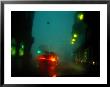 Misty View Of Car Lights On A City Street During A Rain Storm by Sisse Brimberg Limited Edition Pricing Art Print