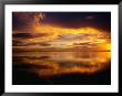 The Setting Sun Casts Light On Dark Clouds And Sea, Cook Islands by Peter Hendrie Limited Edition Print