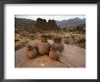 Wari Indian Vessels And Beads With Wari Ruins In The Background by Kenneth Garrett Limited Edition Print