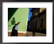 Man Shielding Eyes Whilst Walking Past Wall, Sancti Spiritus, Cuba by Corey Wise Limited Edition Pricing Art Print