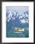 Seaplane In Flight Near Mountains, Ak by Jim Oltersdorf Limited Edition Print