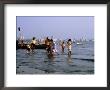 Locals Cooling Off In Polluted Waters At Chowpatty Beach, Mumbai, India by Peter Ptschelinzew Limited Edition Print
