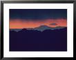 A Red Sun Sets Behind A Mountain Range Near Las Vegas by Maria Stenzel Limited Edition Print
