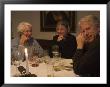 A Family Sits Around The Dinner Table At A Restaurant, Fraueninsel, Chiemsee, Bavaria, Germany by Taylor S. Kennedy Limited Edition Print