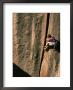 A Woman Climbs A Crack In A Cliff Face by Bill Hatcher Limited Edition Pricing Art Print