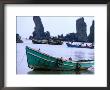Fishing Boats In Front Of The Father And Son Rock Formations At Duong Beach Near Ha Tien, Vietnam by John Banagan Limited Edition Print