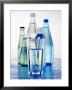 A Glass In Front Of Mineral Water Bottles by Alexander Feig Limited Edition Print