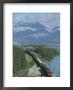 Canadian National Railways Goods Train Along Athabasca River, Jasper National Park, Rocky Mountains by Ursula Gahwiler Limited Edition Print