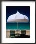 Chairs And Umbrella At Jumeirah Beach, Ritz Carlton Hotel, Dubai, United Arab Emirates by Izzet Keribar Limited Edition Pricing Art Print
