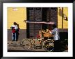 Street Vendor With Bicycle Cart Laden With Fruit And Vegetables, Mexico by Charlotte Hindle Limited Edition Print