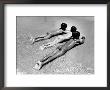 Three Native Boys Sunbathing Nude At The Edge Of The Surf At Ocean Beach by Howard Sochurek Limited Edition Print