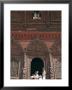 Children Play Beneath The Figures Of Shiva And Parvati At A Temple In Durbar Square, Nepal by Don Smith Limited Edition Print