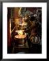 Woman Adding The Melting Yak Butter From Her Lamp To Those Of The Temple, Bharkor, Tibet by Don Smith Limited Edition Print