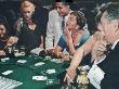 Patrons Trying Their Luck At The Blackjack Table In The Moulin Rouge Casino by Loomis Dean Limited Edition Print