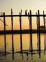 Young Woman Walking Across The Ubein Bridge In Mandalay, Burma At Sunset by Scott Stulberg Limited Edition Pricing Art Print