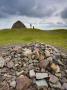 Stone Cairns And Dogwalker At Dunkery Beacon In Exmoor National Park, Somerset, England, Uk by Adam Burton Limited Edition Print