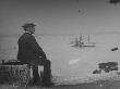 Photographer Wallace G. Levison On Statue Of Liberty Island Looking Out At Boats In Ny Harbor by George B. Brainerd Limited Edition Print