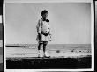 Young Chester Lord Standing On The Beach At Sea Gate, Brooklyn, Ny by Wallace G. Levison Limited Edition Print