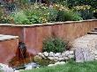 Petersfield Garden Wooden Bridge Over Stream With Rendered Wall And Water Feature by Clive Nichols Limited Edition Print