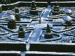 A Snow Covered Knot Garden At Great Fosters, Surrey, Photographed From The Roof Of The Hotel by Clive Nichols Limited Edition Print
