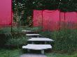 Stepping Stone Steps, Verbena Bonarienses And Stipa Gigantea In Front Of Red Semi-Permanent Screens by Clive Nichols Limited Edition Print