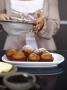 Cooper Residence, Omaha Beach, New Zealand, Detail Of A Woman Dusting Cakes With Sugar by Richard Powers Limited Edition Pricing Art Print