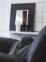 Modern Leather Armchair With Furry Hot Water Bottle And Shelf With Mirror And Vases by Richard Powers Limited Edition Print