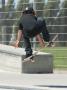 Young Boy Flying Through The Air On A Skateboard, From Behind by Stephen Sharnoff Limited Edition Print