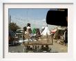 Afghans Sit In The Back Of A Cart On The Outskirt Of Kabul, Afghanistan, September 28, 2006 by Musadeq Sadeq Limited Edition Print