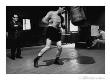 Lifeâ® - Walter Cartier Working The Heavy Bag With Charlie Goldman, 1951 by Eliot Elisofon Limited Edition Print