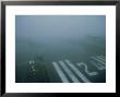 Lukla Airport In Low Cloud, Khumbu, Nepal by Paul Franklin Limited Edition Print