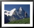 Hiker Looking To The Snow-Covered Monch And The North Face Of The Eiger, Swiss Alps, Switzerland by Ruth Tomlinson Limited Edition Print