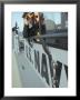 Us Navy Mate Looks Through Binoculars As He Patrols The Coastal Waters Of The Persian Gulf by Stocktrek Images Limited Edition Print