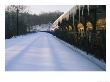 A Pristine Blanket Of Snow Covers An Empty Train Station by Nick Caloyianis Limited Edition Print