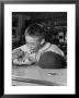 Boy Wearing Baseball Uniform Eating Banana Split At Soda Fountain Counter by Joe Scherschel Limited Edition Print