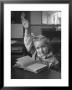 School Girl Raising Her Hand To Answer A Question by Nina Leen Limited Edition Pricing Art Print