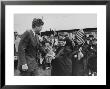 Irish Schoolchildren Waving Flag As They Greet President John F. Kennedy by John Dominis Limited Edition Print
