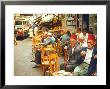 Lebanese Gentlemen Sits At A Steetside Cafe Sipping Tea And Smoking Traditional Narghile Pipes by Carlo Bavagnoli Limited Edition Print